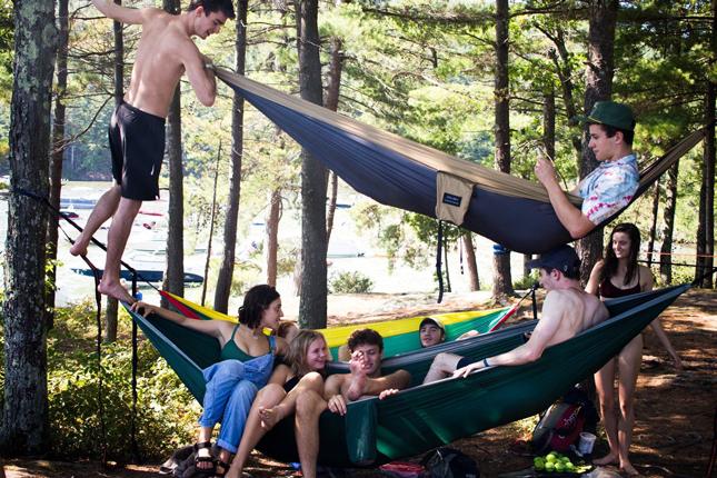 Skidmore students hang out in hammocks after a hike in the mountains