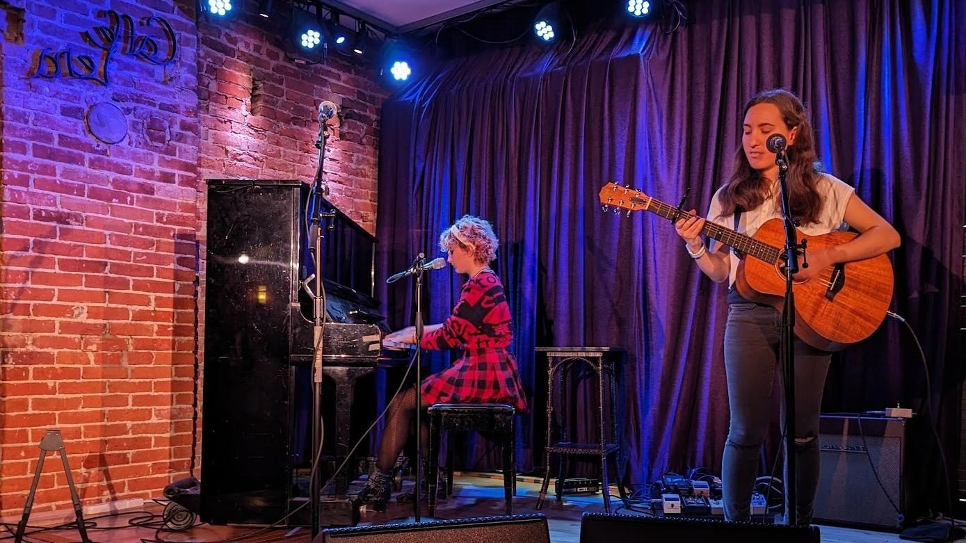 Sarah Libov ’24, playing guitar, performs with Lucrezia Zichichi, playing piano, at Caffe Lena.